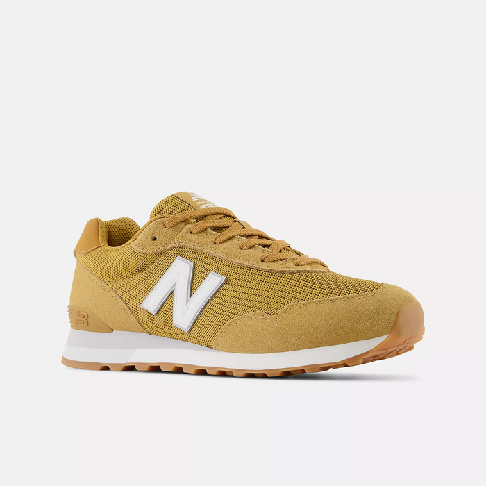 New Balance 515 v3 sneakers in mustard yellow with white logo, suede overlays, and gum outsole, angled side view.