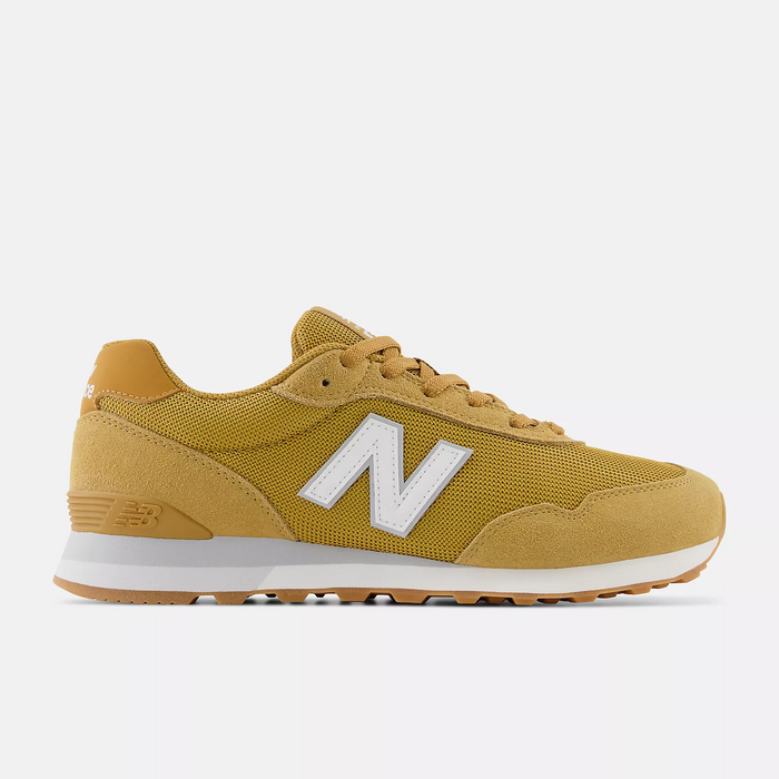 New Balance 515 v3 sneakers in mustard yellow with suede overlays, mesh upper, white midsole, and gum outsole, side view.