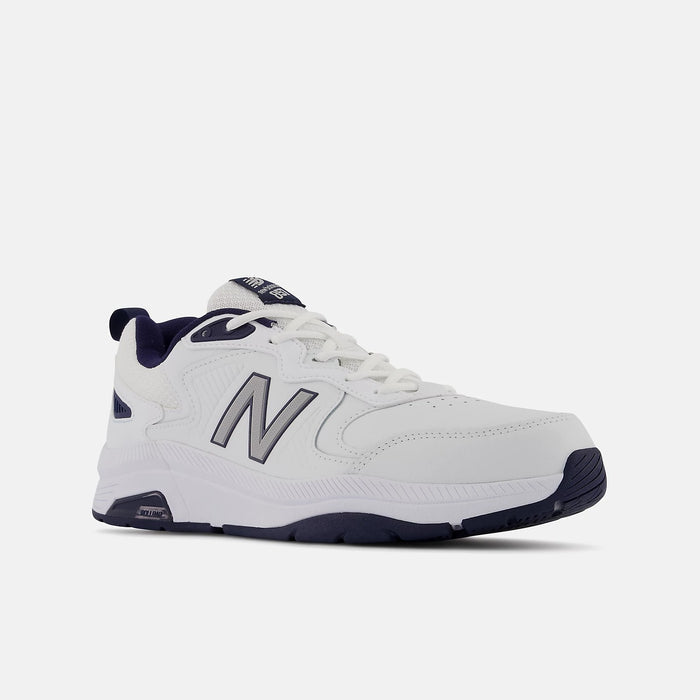 New Balance 857v3 training shoes in white and navy, featuring durable leather upper, cushioned midsole, and stability features, angled front view.