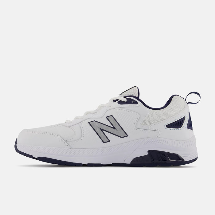 New Balance 857v3 training shoes in white with navy blue accents, leather upper, and durable rubber outsole, side view.