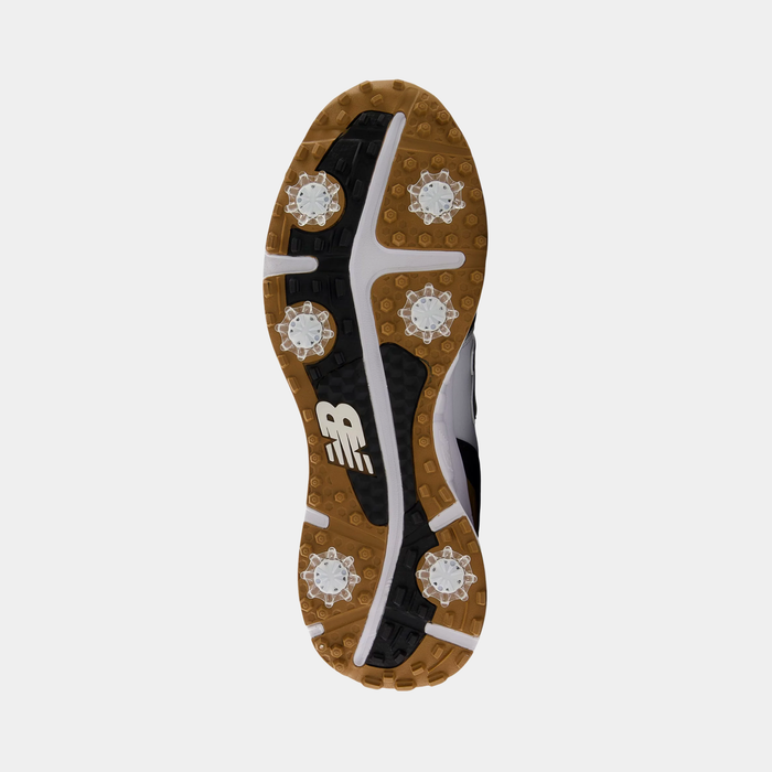 New Balance Golf 997 Golf shoe sole in black, white, and gum with cleats and traction-enhancing grip details.
