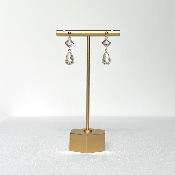 This earring set features a petite pink glass bezel set charm with a clear crystal teardrop shape fancy prong bezel setting hung on a 3mm gold filled earring stud post.