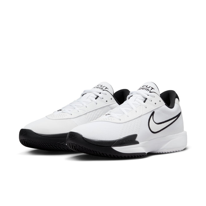 Nike Air Zoom G.T. Cut Academy basketball shoes in white with black accents, mesh upper, and Zoom Air cushioning, front-side view.