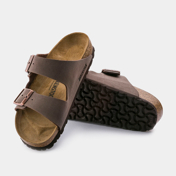 Birkenstock Arizona Birko-Flor® Nubuck sandals in brown with dual adjustable straps, cork footbed, and textured outsole, angled view.