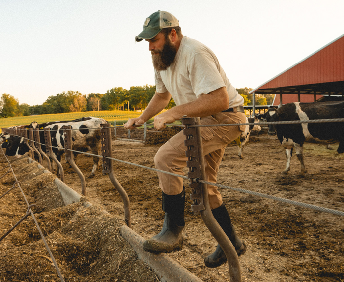 Bogs Classic Seamless Tall NT boots in black, waterproof design with durable construction, worn on a farm.
