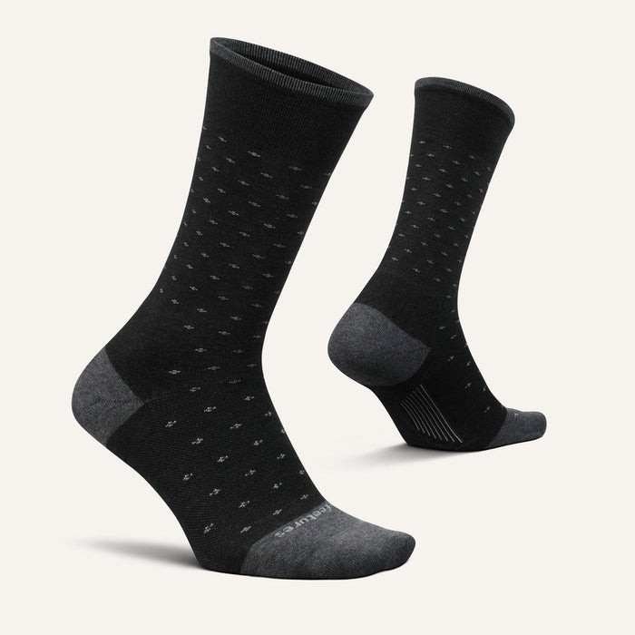 Feetures Everyday Men's Max Cushion Crew socks in black with subtle dotted pattern, reinforced gray toe and heel details, side angle view.