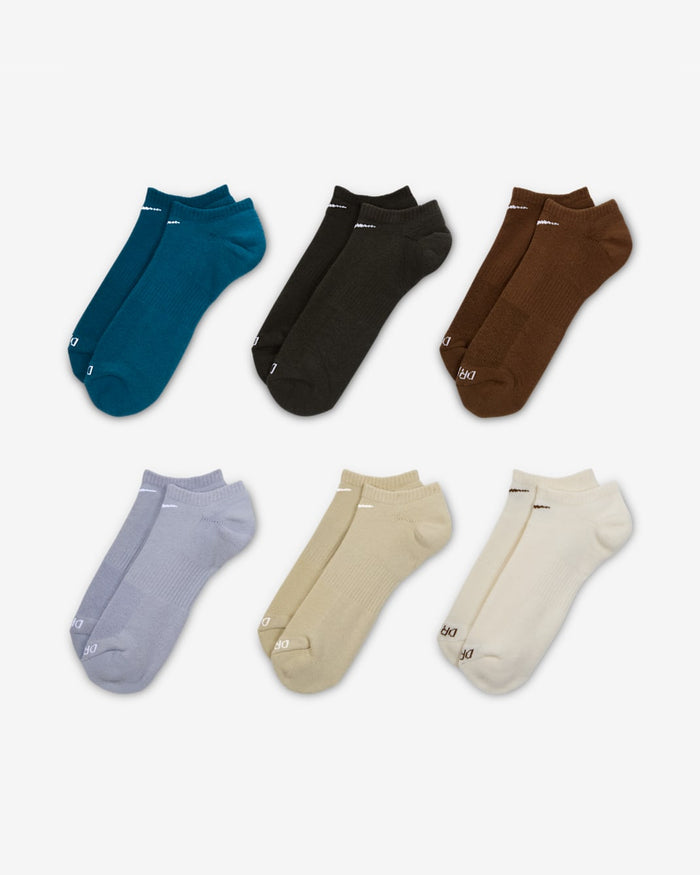 Nike Everyday Plus Cushioned No Show Socks in assorted colors including teal, black, brown, gray, beige, and white, front view showing ribbed cuffs and smooth finish.