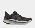 New Balance Fresh Foam Vongo v5 running shoes in black with purple accents, mesh upper, and cushioned Fresh Foam midsole, side view.