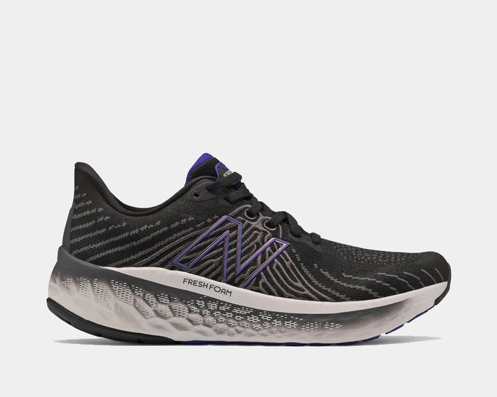 New Balance Fresh Foam Vongo v5 running shoes in black with purple accents, mesh upper, and cushioned Fresh Foam midsole, side view.