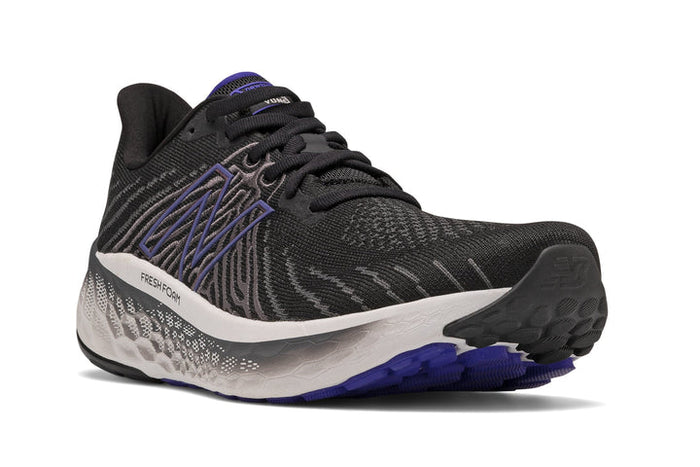 New Balance Fresh Foam Vongo v5 running shoes in black and purple with breathable mesh upper and cushioned midsole, angled front view.