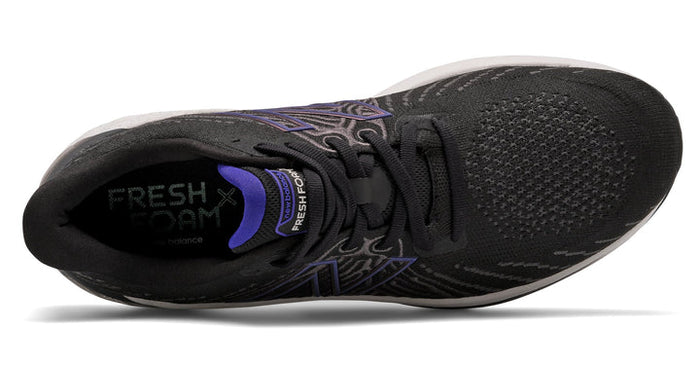 New Balance Fresh Foam Vongo v5 running shoes in black with purple accents, top view showing mesh upper and lace system.