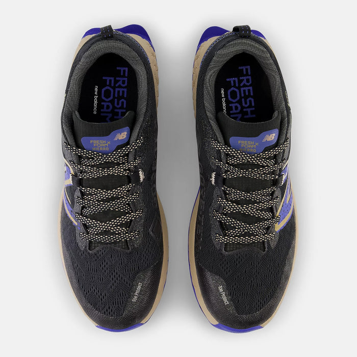 New Balance Fresh Foam X Hierro v7 Gore-Tex trail running shoes, black mesh upper with tan and purple accents, top view showing lace system and Gore-Tex branding.