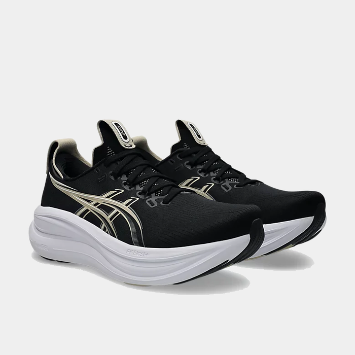 Asics Gel-Nimbus 28 running shoes in black and white with FlyteFoam technology, side/front angle.