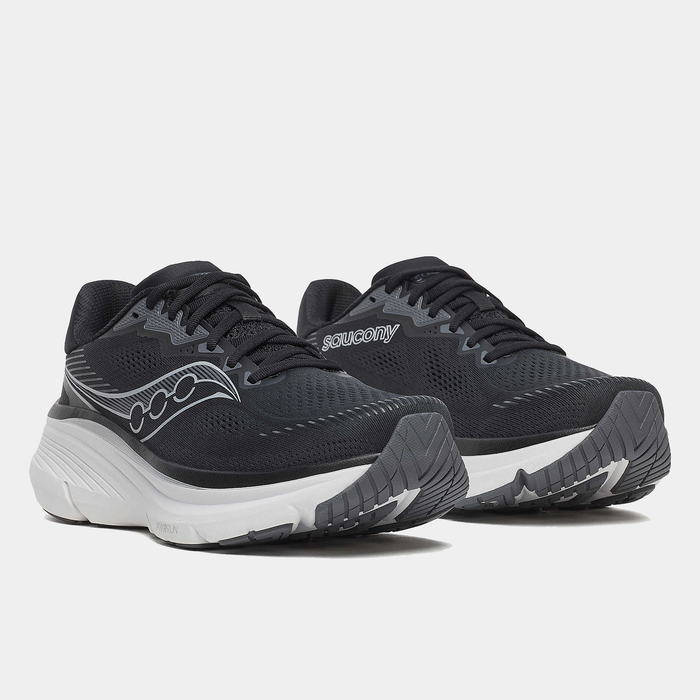 Saucony Guide 19 running shoes in black with white midsole and mesh upper, side/front angled view.