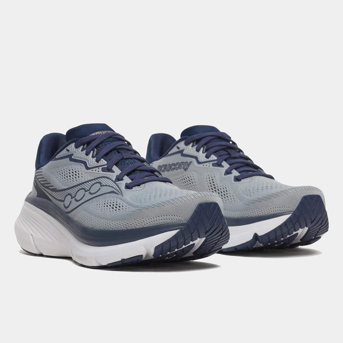 Saucony Guide 19 running shoes in light gray with navy accents, mesh upper, and PWRRUN cushioning, angled front view.