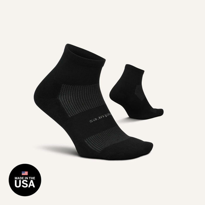 Feetures High Performance Max Cushion Quarter socks in black with cushioned sole and breathable mesh panels, angled front view.