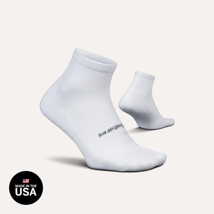 Feetures High Performance Max Cushion Quarter socks in white with padded sole and quarter-length cuff, side angle view.