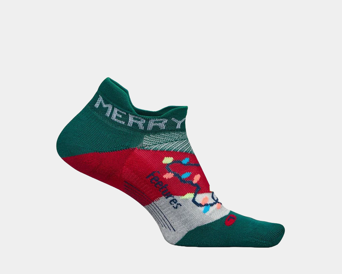 Feetures Limited Edition "Merry & Bright" Elite Light Cushion No Show Tab Socks, festive green, red, and gray design with colorful holiday lights, side view.