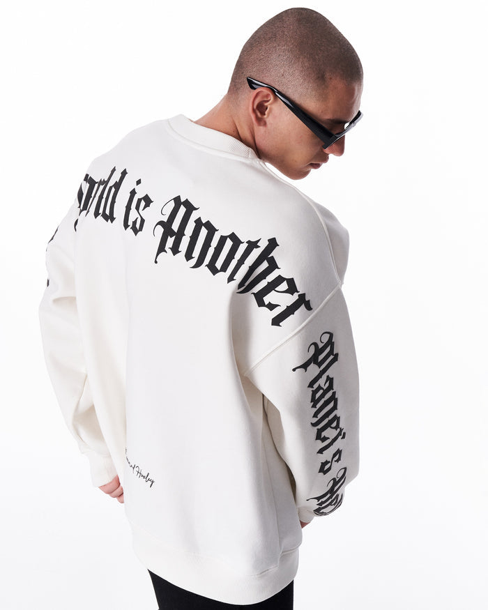 Martin Valen men's white oversized sweatshirt 'Another World's Hell', rear three-quarter view showing large black gothic back print