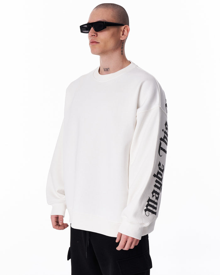 Martin Valen white oversized men's sweatshirt 'Another World's Hell', three-quarter front view showing collar and right sleeve