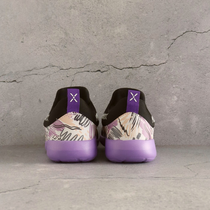 Black and purple 90s style kids slip-on sneakers with bold patterns and supportive cushioning.