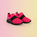 Pink and black shoes on a gradient background