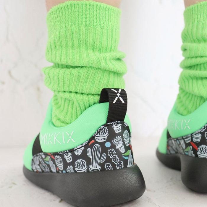 Slip-on sneaker and bright solid coloured cotton slouch socks for kids in green.