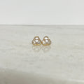 Three in one shaped triangular gold and cubic zirconia stud earrings, representing the Most Holy Trinity.