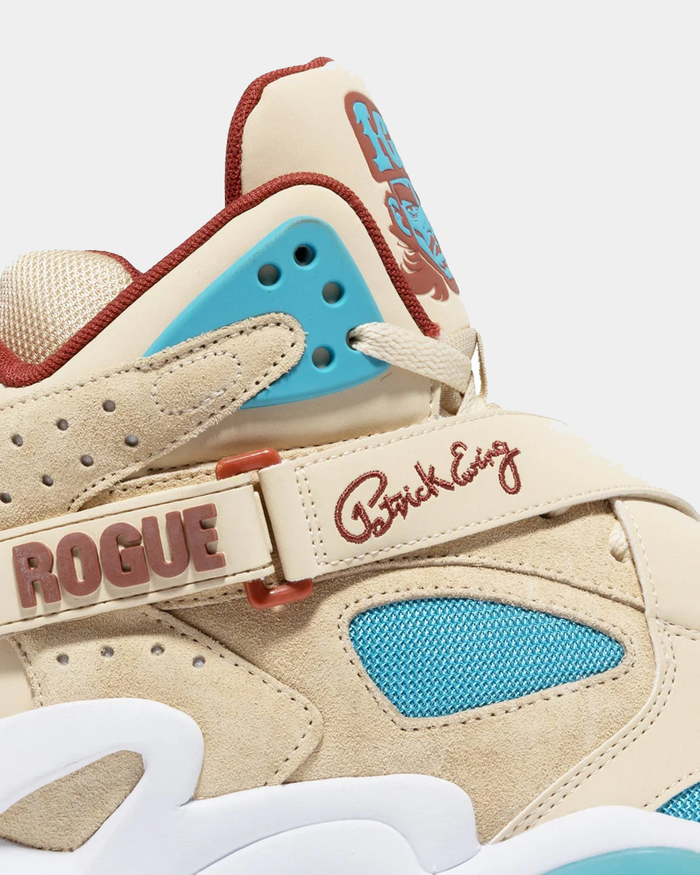 Ewing Athletics ROGUE x ICE T sneakers in beige and teal with suede overlays, mesh accents, and branded strap details, side view.