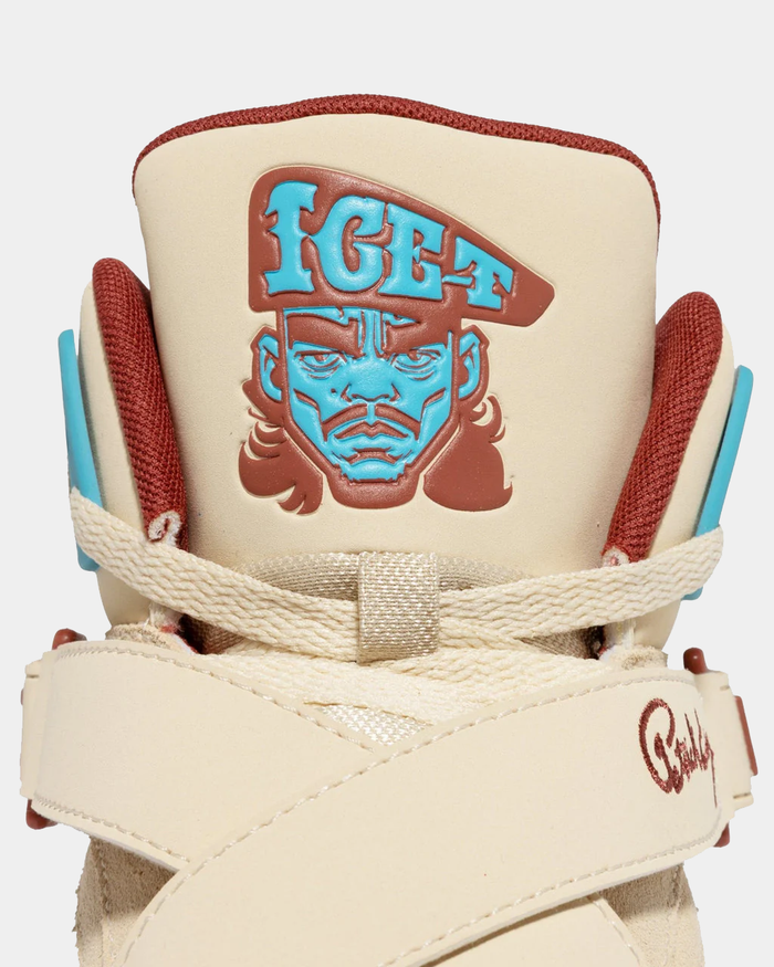Ewing Athletics ROGUE x ICE T sneakers featuring cream leather upper, maroon accents, and an "ICE-T" graphic on the tongue, close-up view.