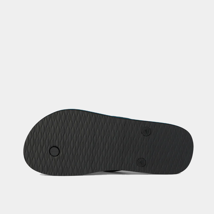 Reef Seaside flip-flops black rubber sole with textured grip, bottom view.