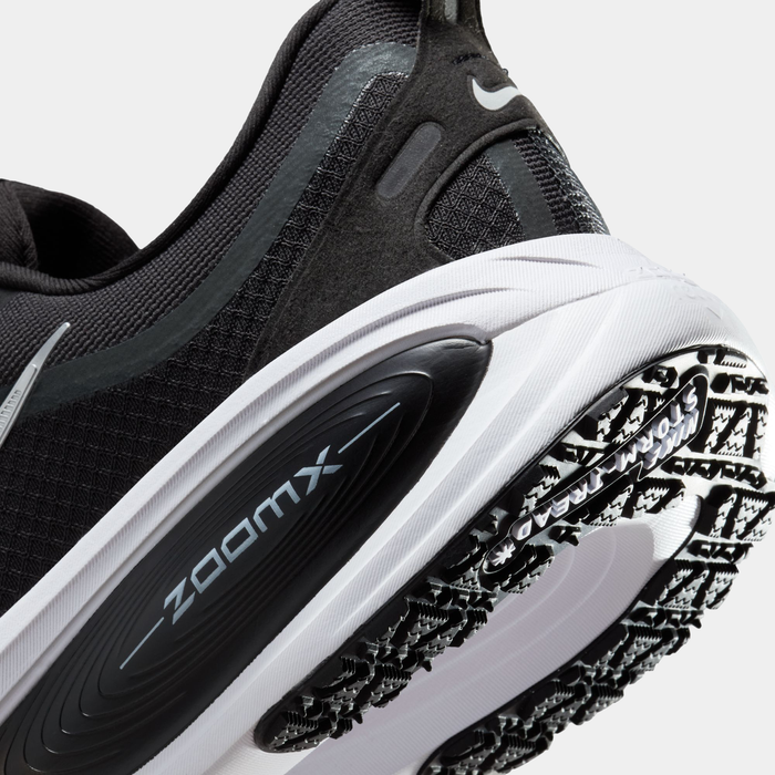 Nike Vomero 18 GORE-TEX running shoes, close-up of black mesh upper, durable heel counter, and patterned Storm-Tread outsole.